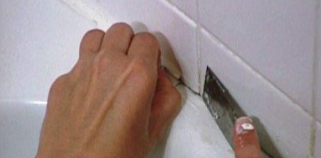 Remove the shower caulking